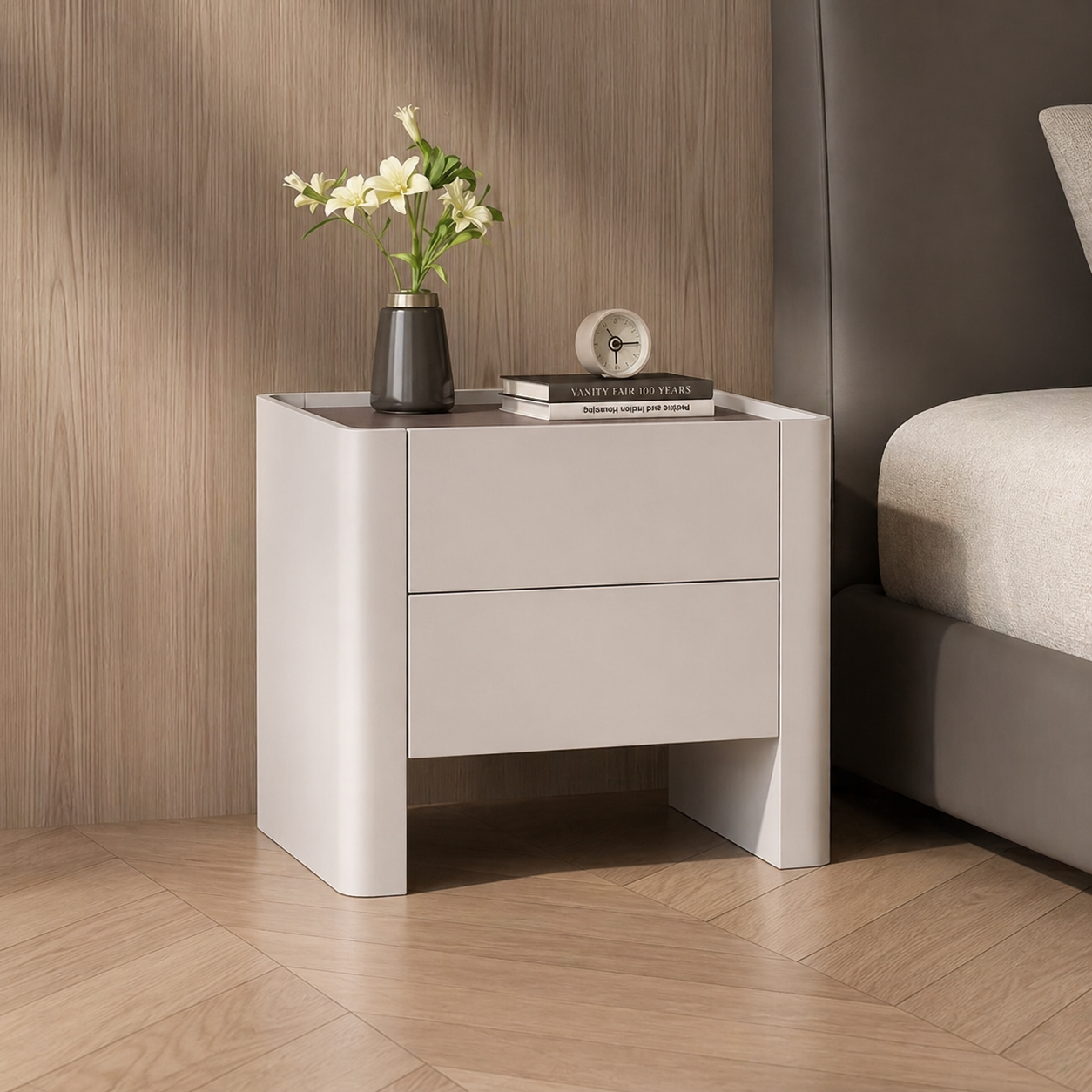 White nightstand with decorative items against a wooden wall.