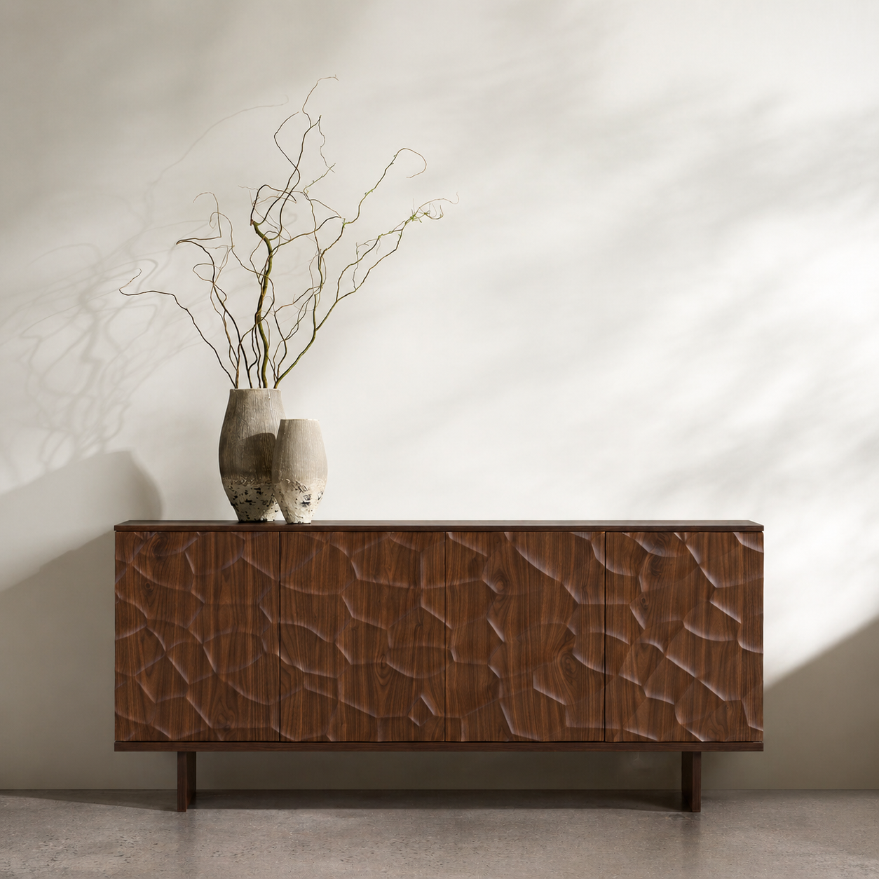 Wooden sideboard with decorative vases on a neutral background