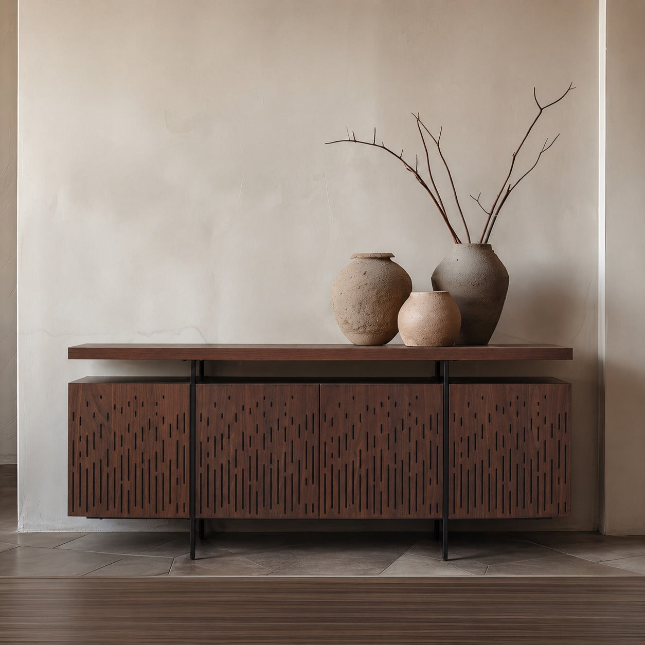 Wooden sideboard with decorative vases against a beige wall