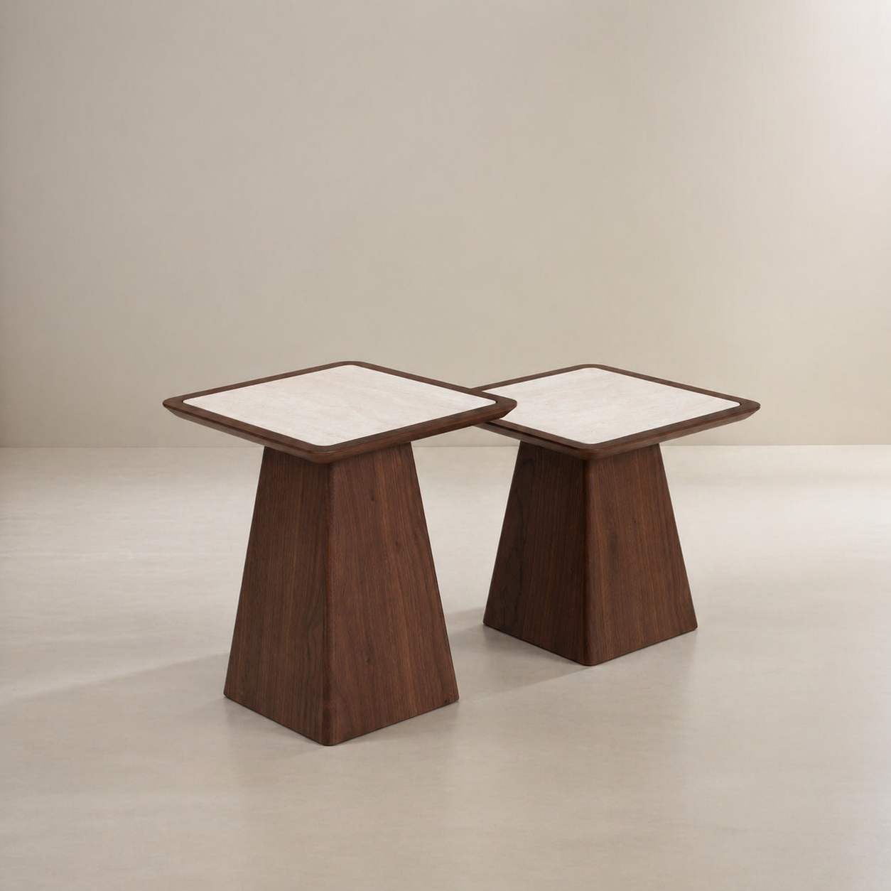 Two wooden side tables with white tops on a plain background