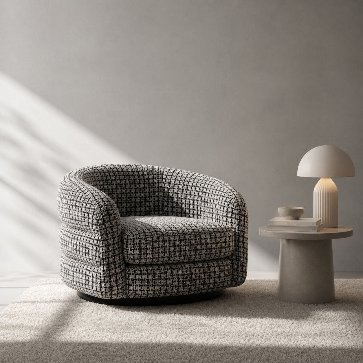 Modern armchair with a side table and lamp in a minimalistic room.