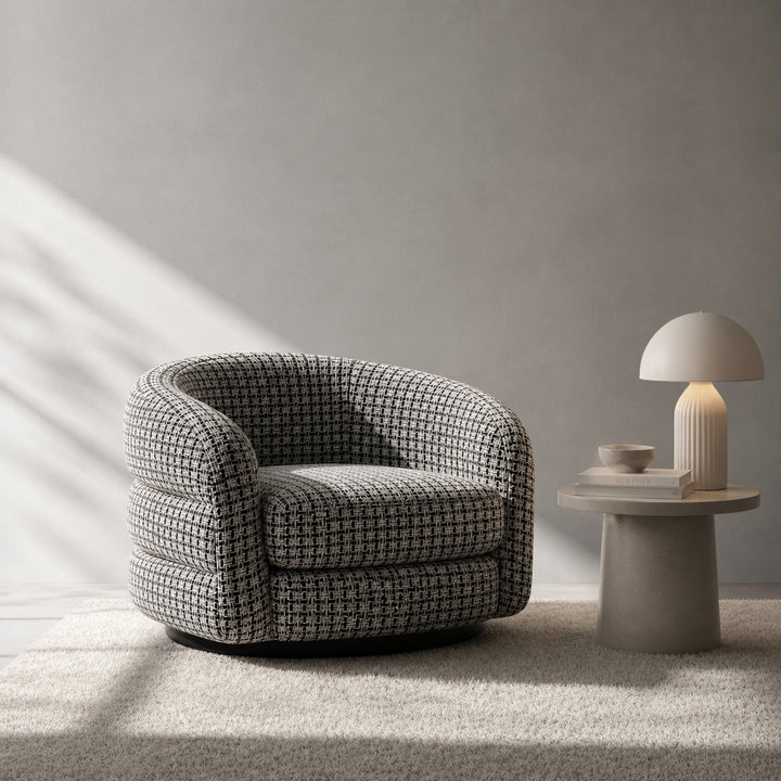 Modern armchair with a side table and lamp in a minimalistic room.