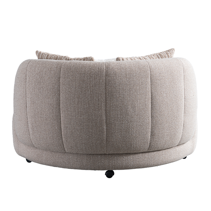Gray round ottoman with cushion on a white background