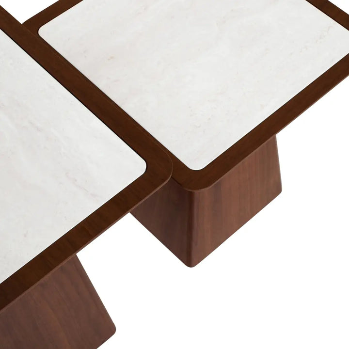 Close-up of a coffee table with marble top and wooden legs on a white background