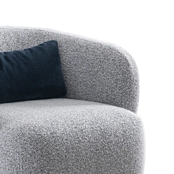 Gray textured armchair with a dark blue cushion on a white background