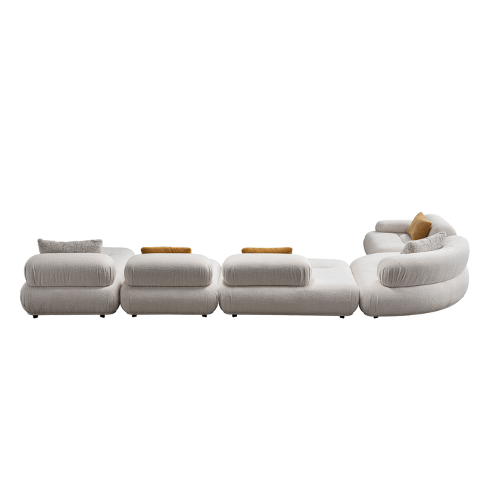 Modern white sofa with wooden accents on a white background