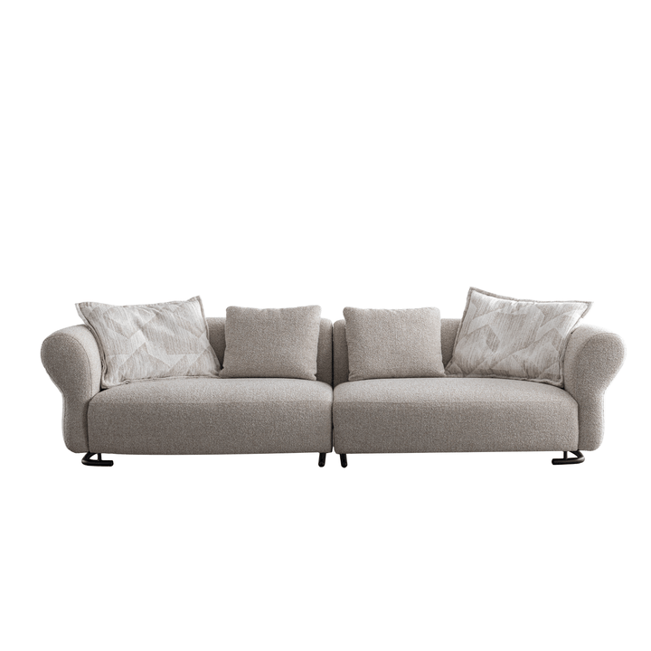Gray sofa with patterned cushions on a white background