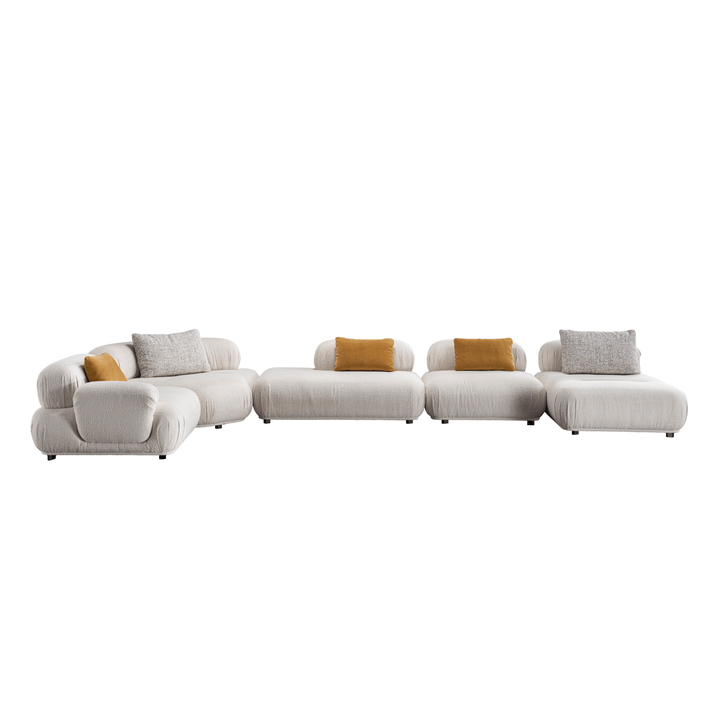 Modern white sectional sofa with yellow and gray cushions on a white background