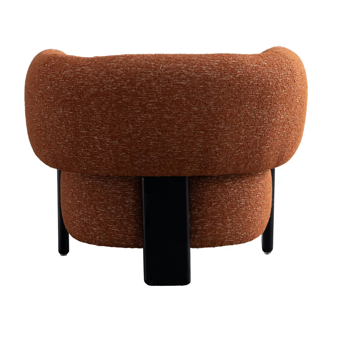 Brown upholstered chair with black legs on a white background