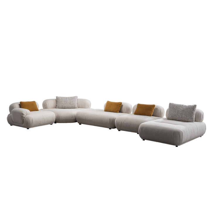 Modern beige sectional sofa with brown and gray cushions on a white background