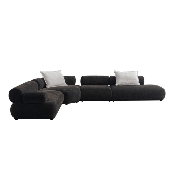Black sectional sofa with gray cushions on a white background