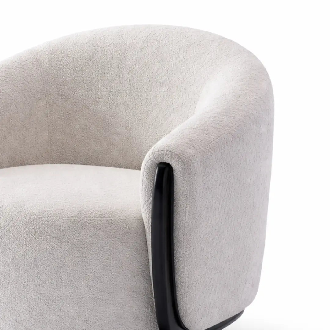 Close-up of a gray armchair with a white background