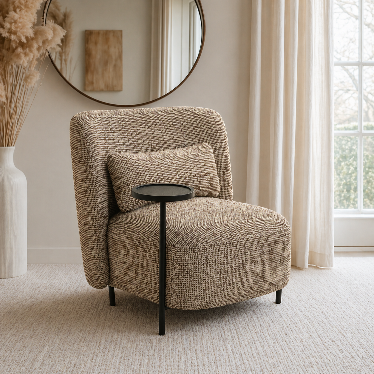 Beige armchair with a small round table in a room with a mirror and window.