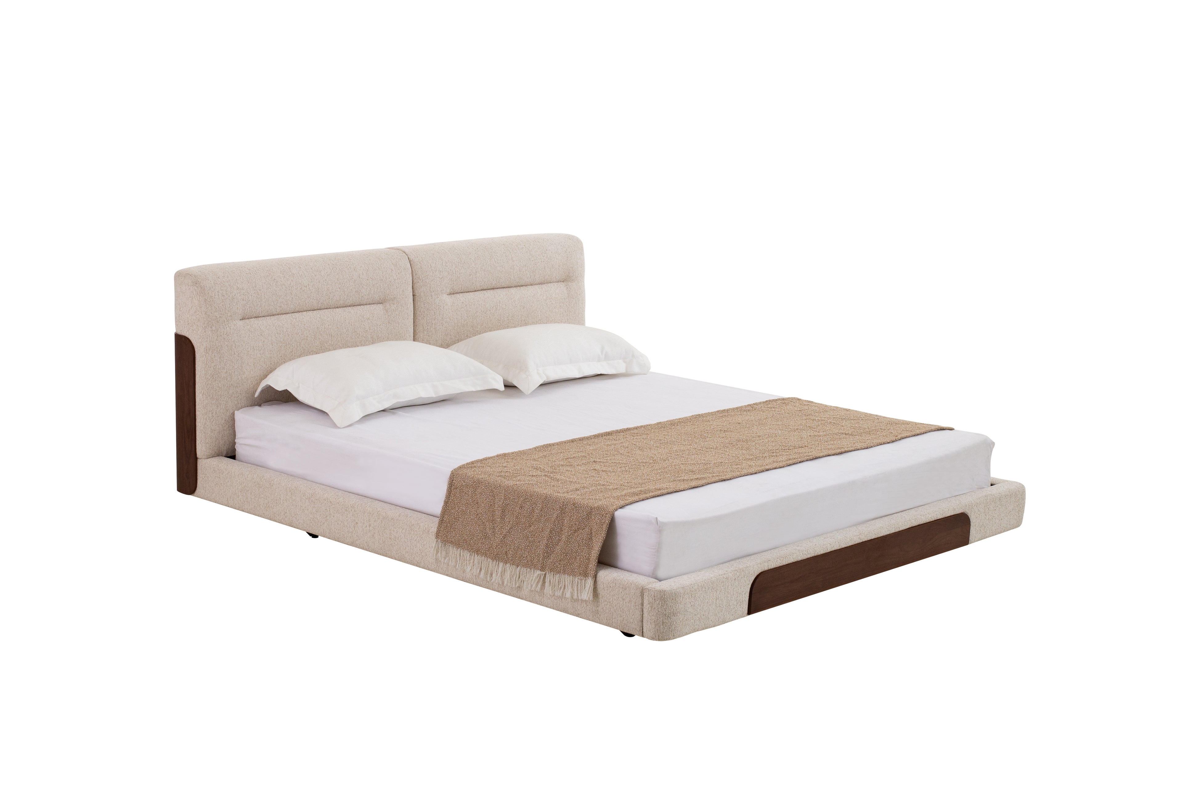Beige upholstered bed with white bedding and a brown blanket on a white background
