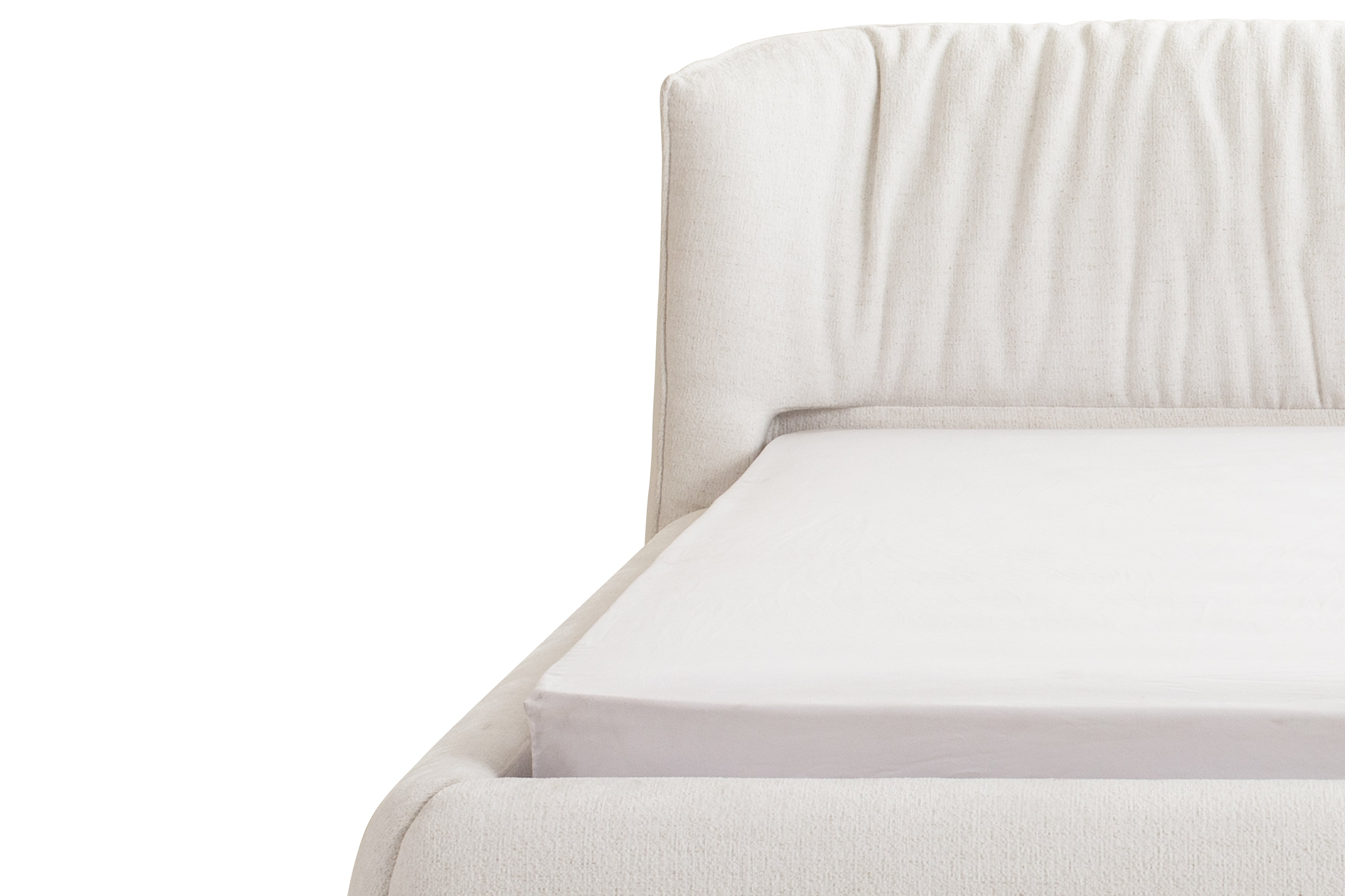 Close-up of a white upholstered bed with a white mattress on a white background