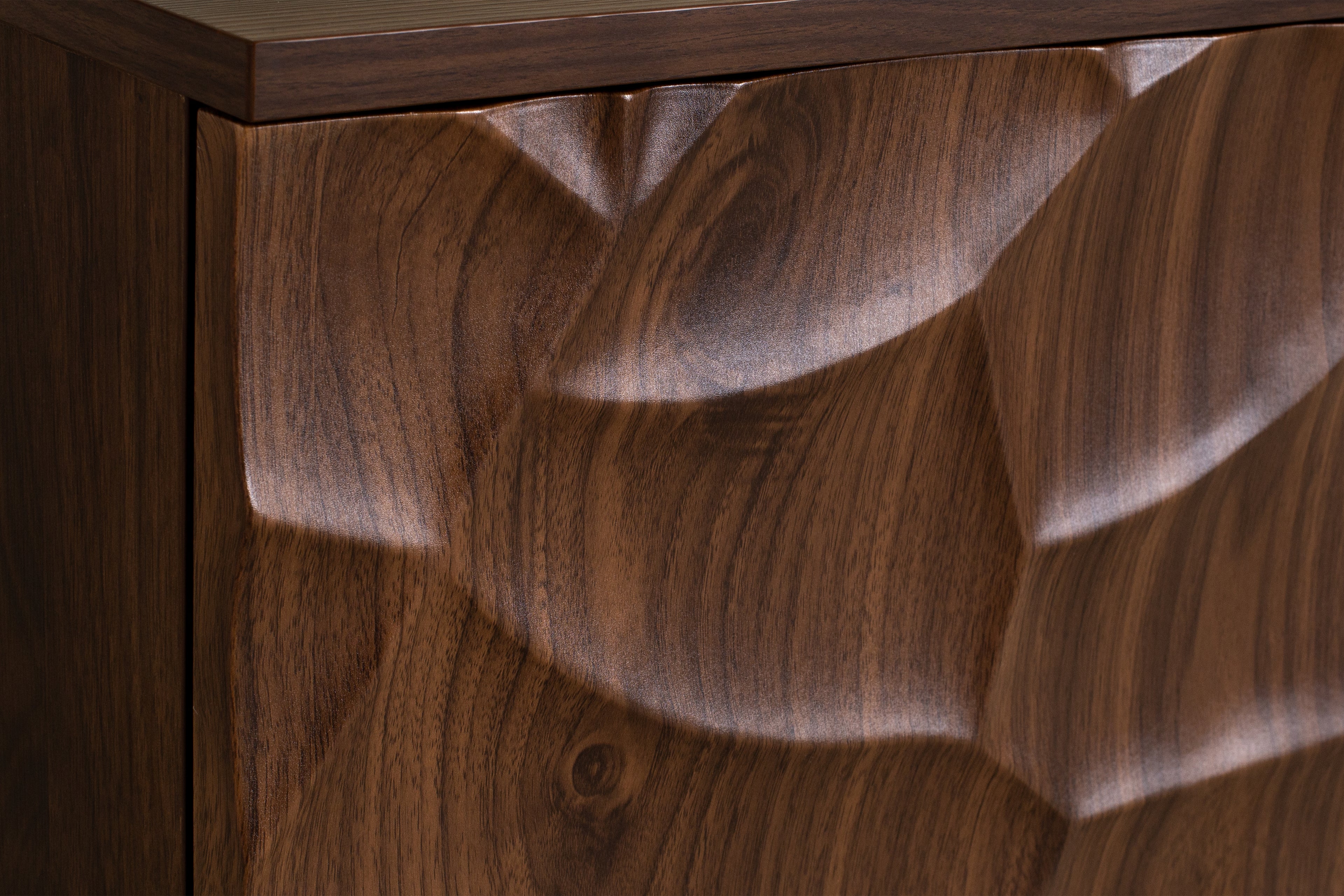 Close-up of a wooden surface with a rich, dark brown finish.