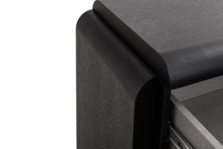 Close-up of a wooden desk corner with a white background