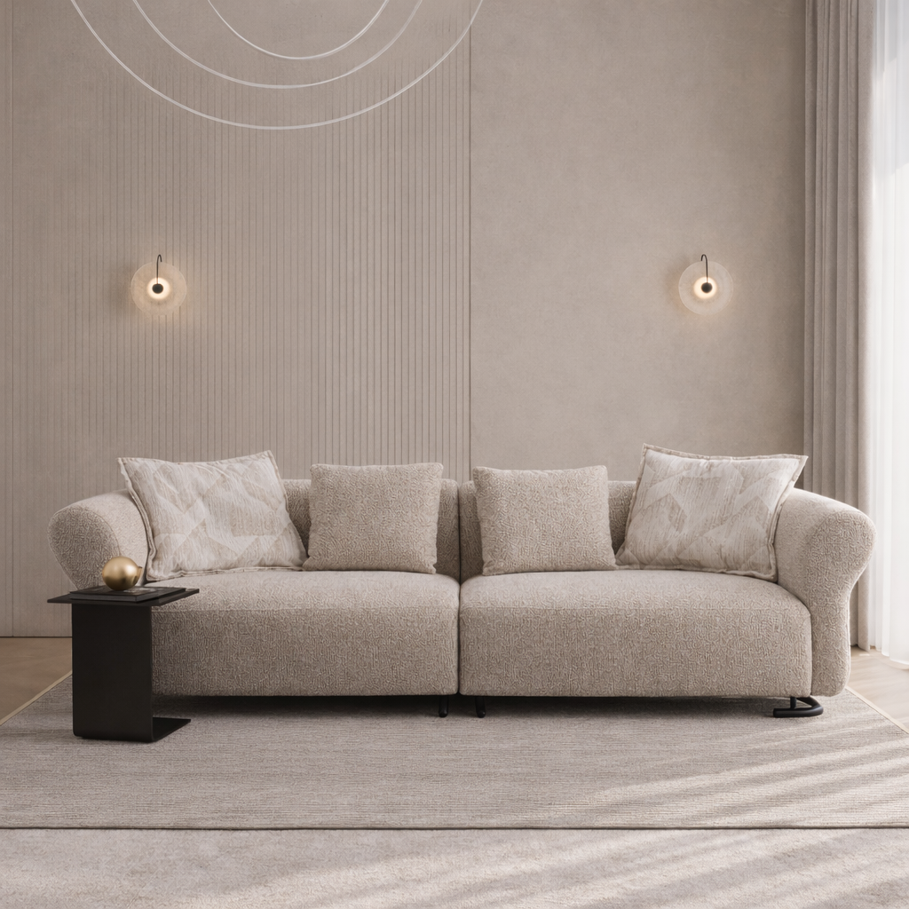 Beige sofa with decorative pillows in a modern living room setting.