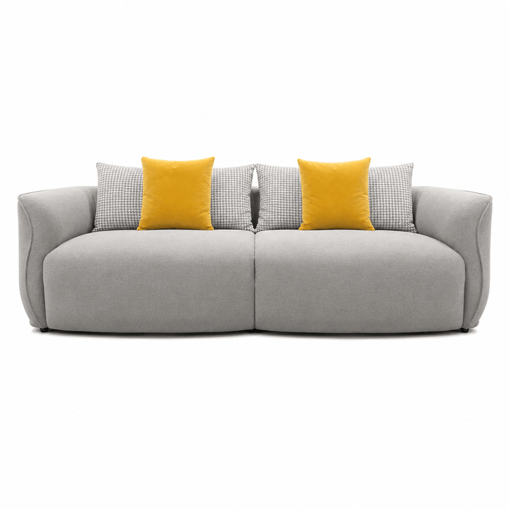 Gray sofa with yellow and patterned cushions on a white background