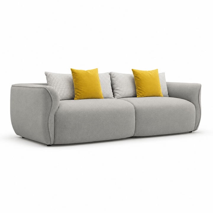 Gray sofa with yellow and patterned cushions on a white background