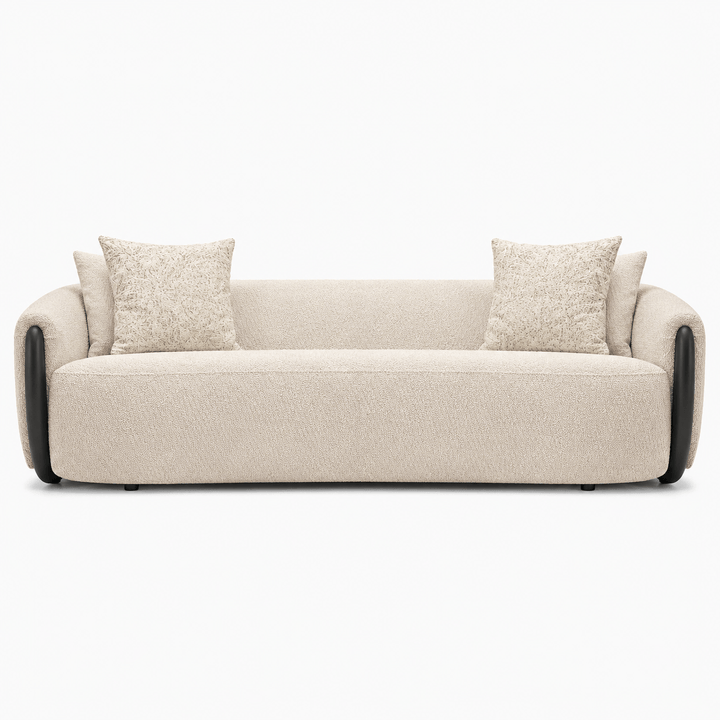 Beige sofa with two cushions on a white background