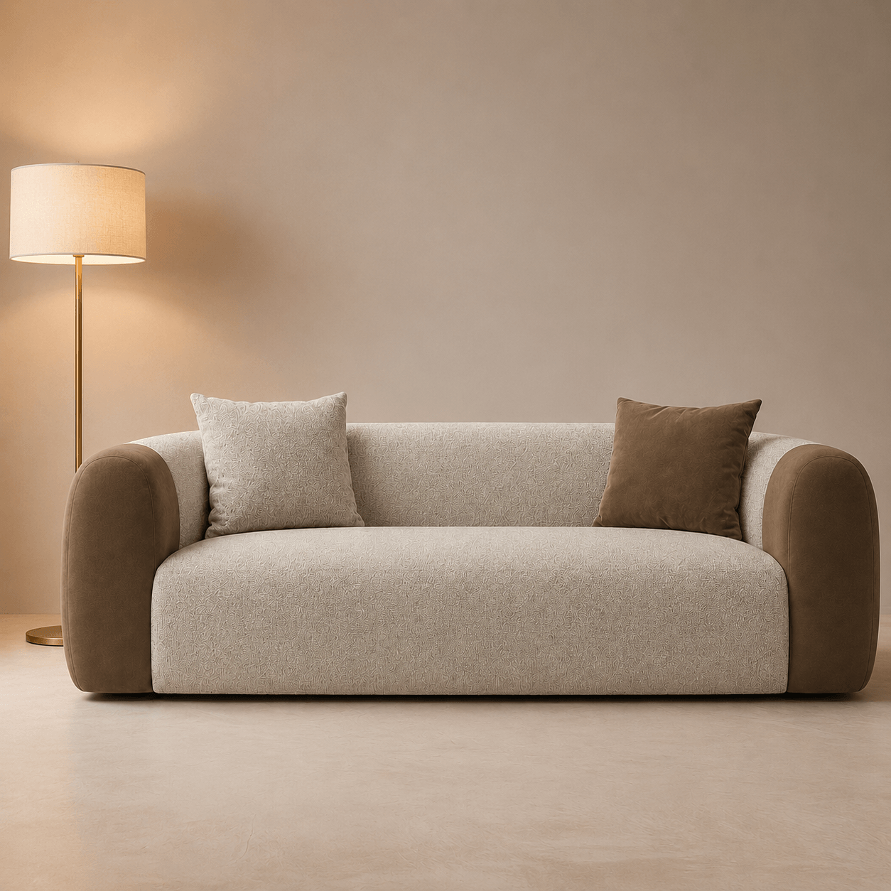 Beige sofa with three cushions in a minimalistic room with a lamp.
