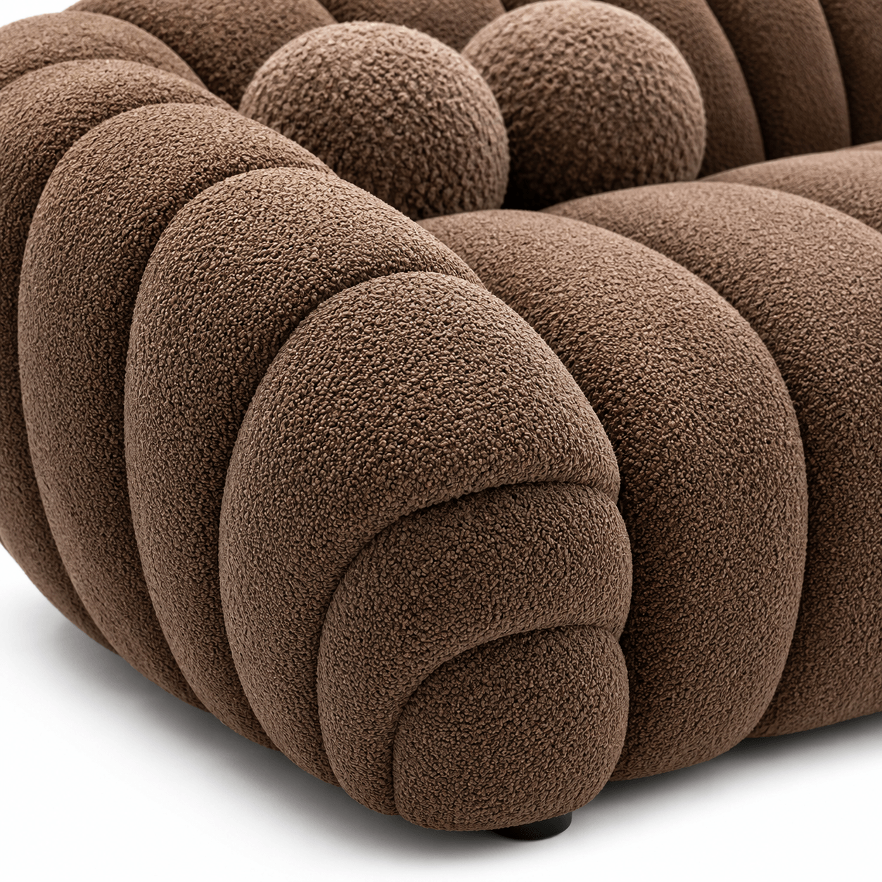 Close-up of a brown textured sofa with a white background