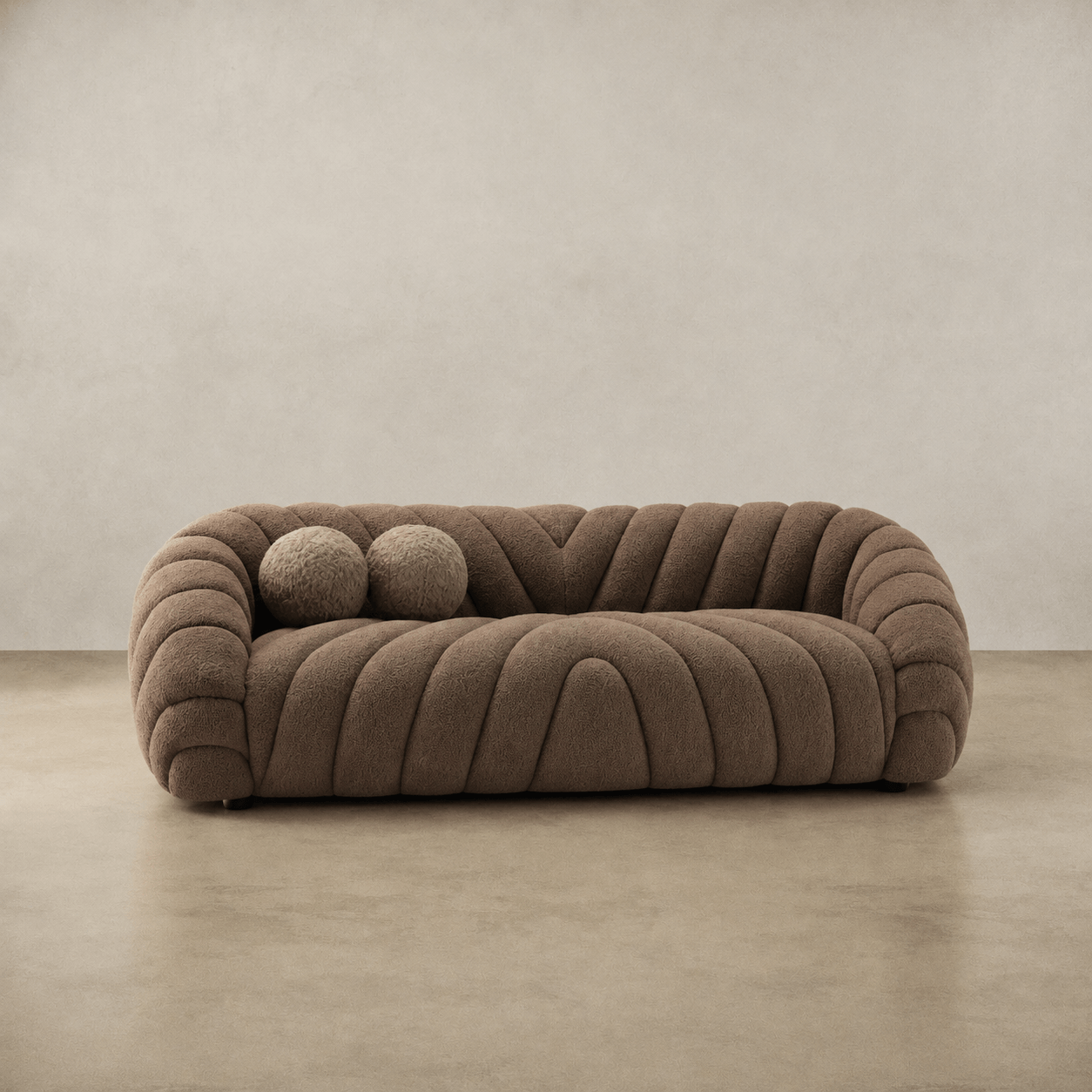 Brown textured sofa on a beige floor with a neutral wall background