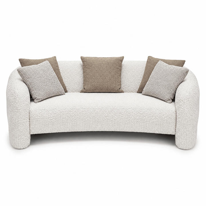 White sofa with brown and gray cushions on a white background
