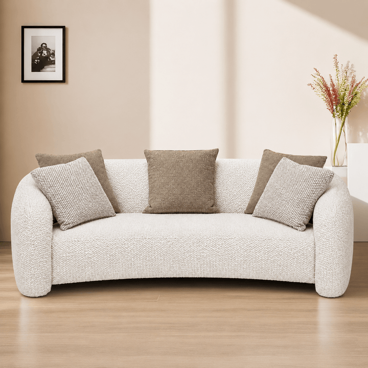 White sofa with gray cushions in a living room setting