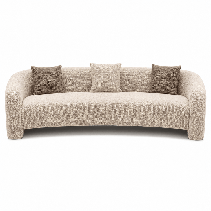 Beige sofa with three cushions on a white background