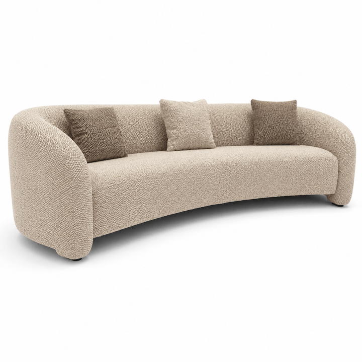 Beige sofa with three cushions on a white background
