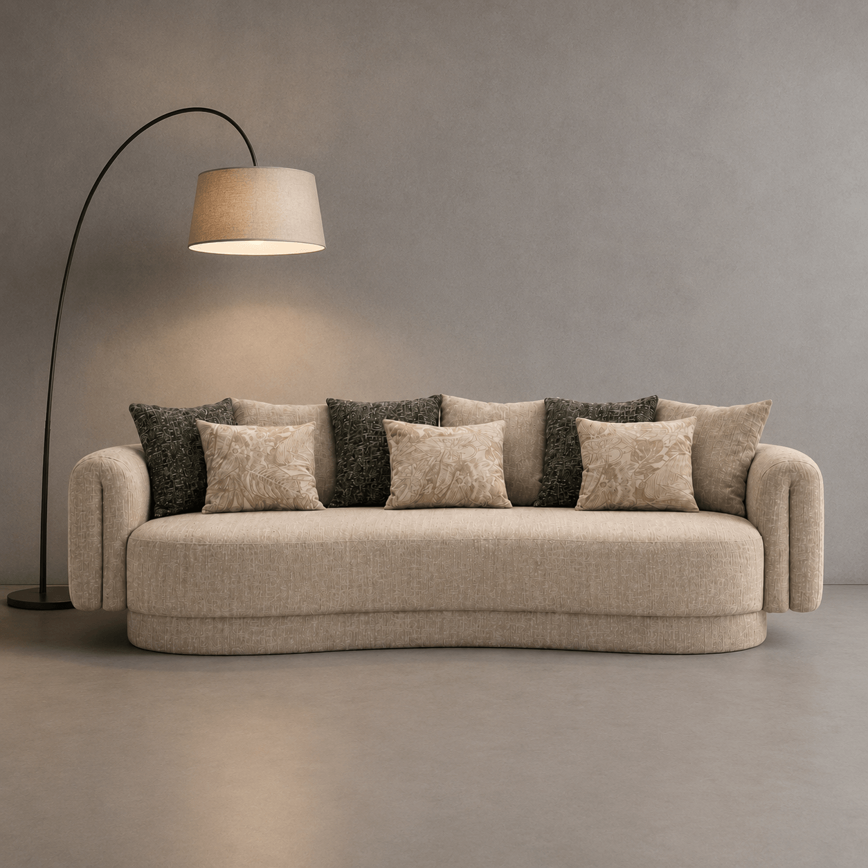 Beige sofa with decorative pillows in a minimalistic room with a floor lamp.