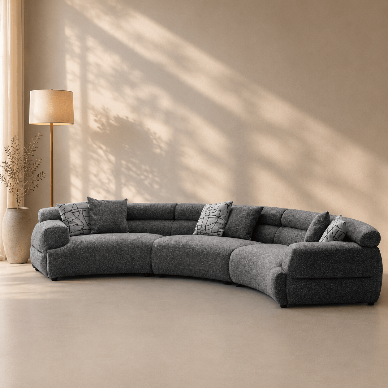 Gray sectional sofa in a room with a lamp and decorative items.