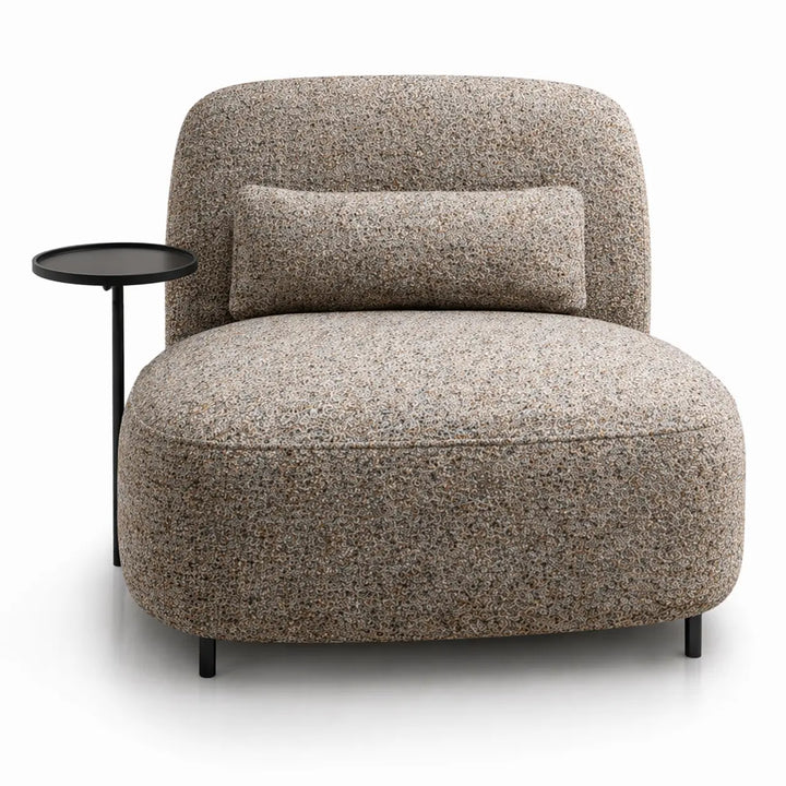 Beige armchair with a pillow and a small round table on a white background