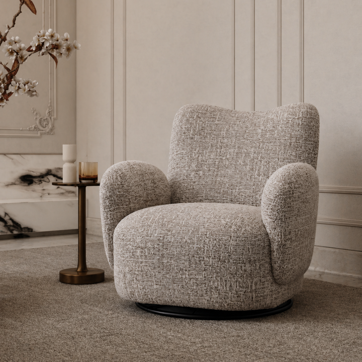 Gray armchair in a stylish room with decorative elements.