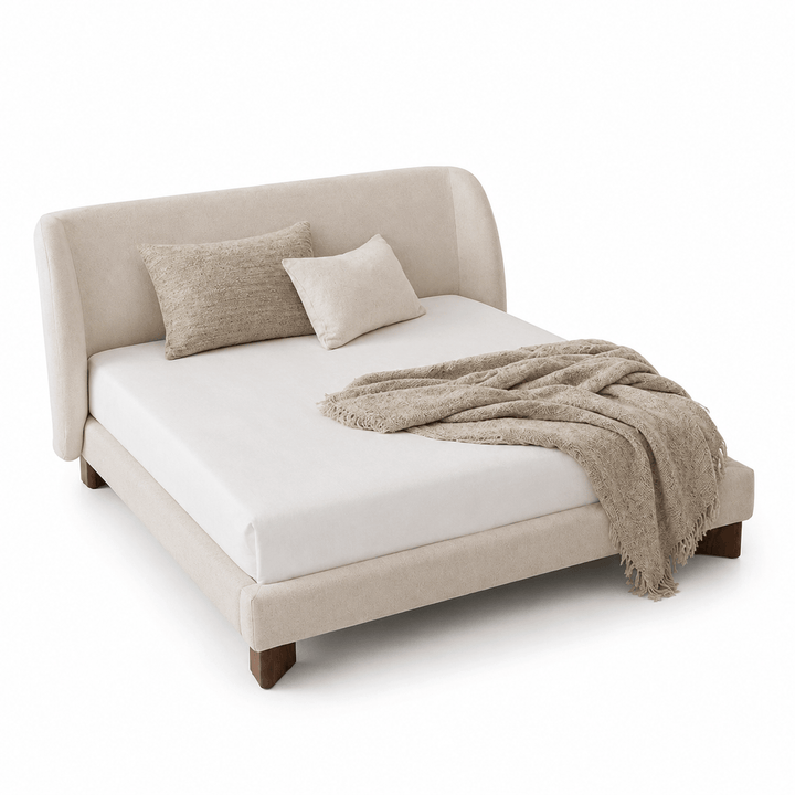 Beige upholstered bed with white mattress and beige blanket on a white background