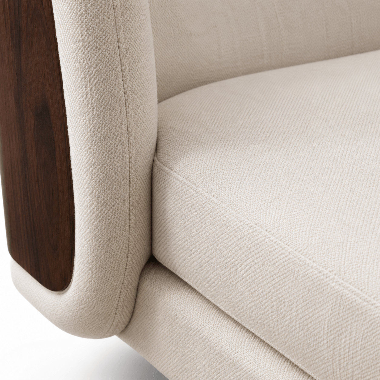 Close-up of a beige upholstered chair with wooden armrest.