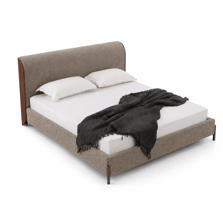Bed with brown upholstered headboard and white bedding on a white background