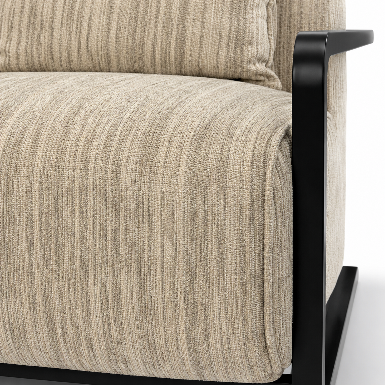 Close-up of a textured beige sofa with a black metal armrest on a white background