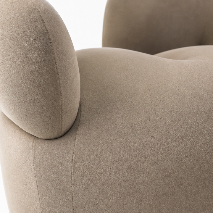 Close-up of a beige armchair with soft texture