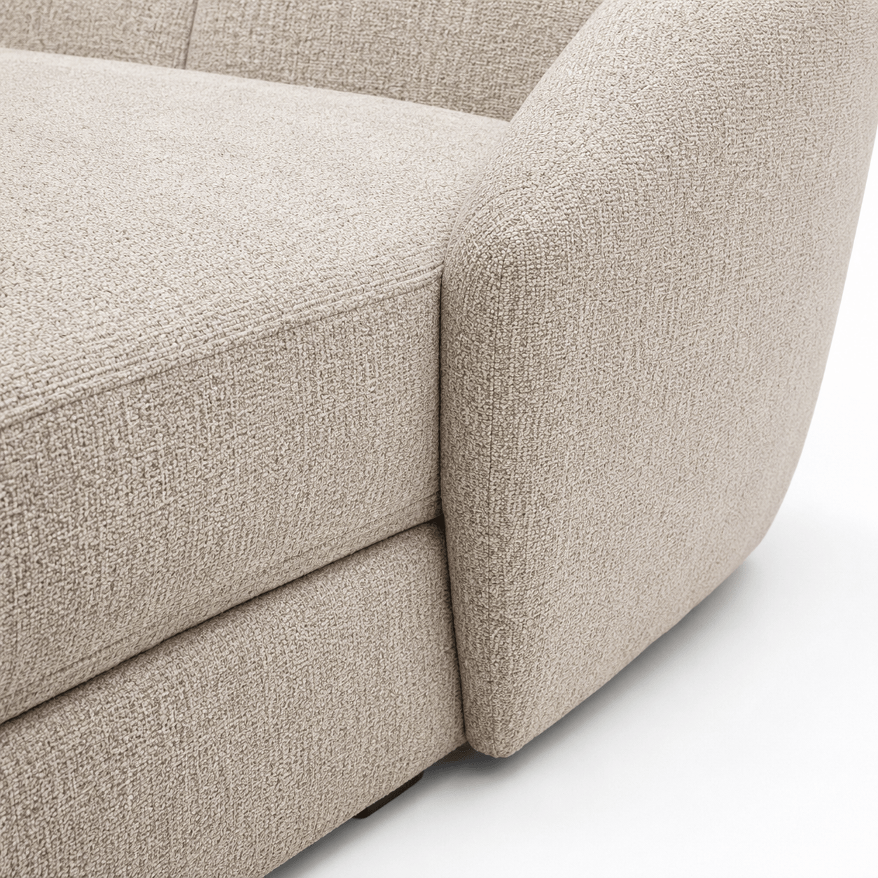Close-up of a beige textured sofa corner on a white background