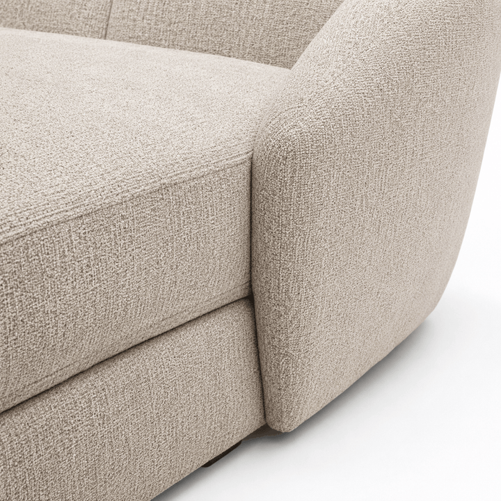 Close-up of a beige textured sofa corner on a white background