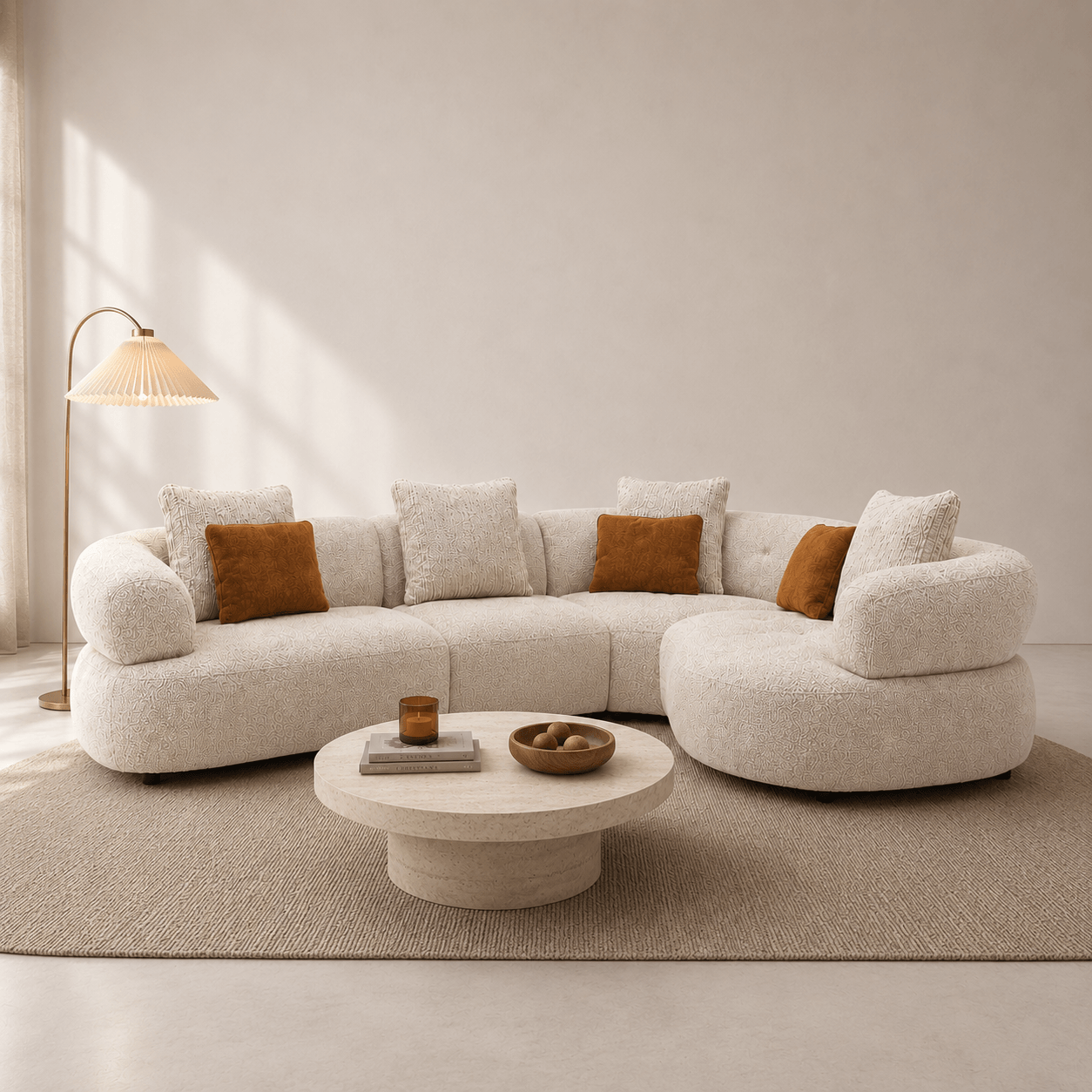 Modern living room with a beige sectional sofa, round coffee table, and decorative pillows.