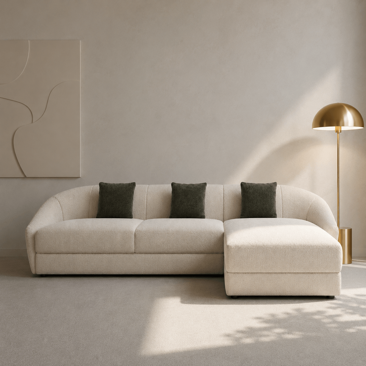 Beige sectional sofa with gray cushions in a modern living room setting.