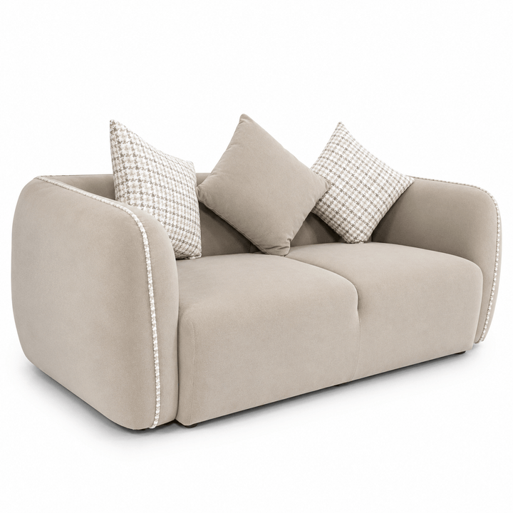 Beige sofa with decorative pillows on a white background