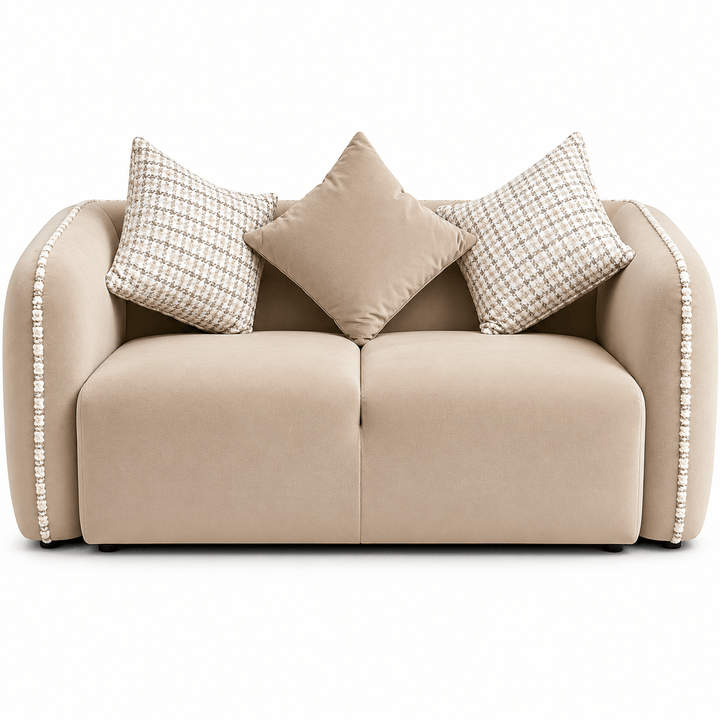 Beige sofa with patterned cushions on a white background