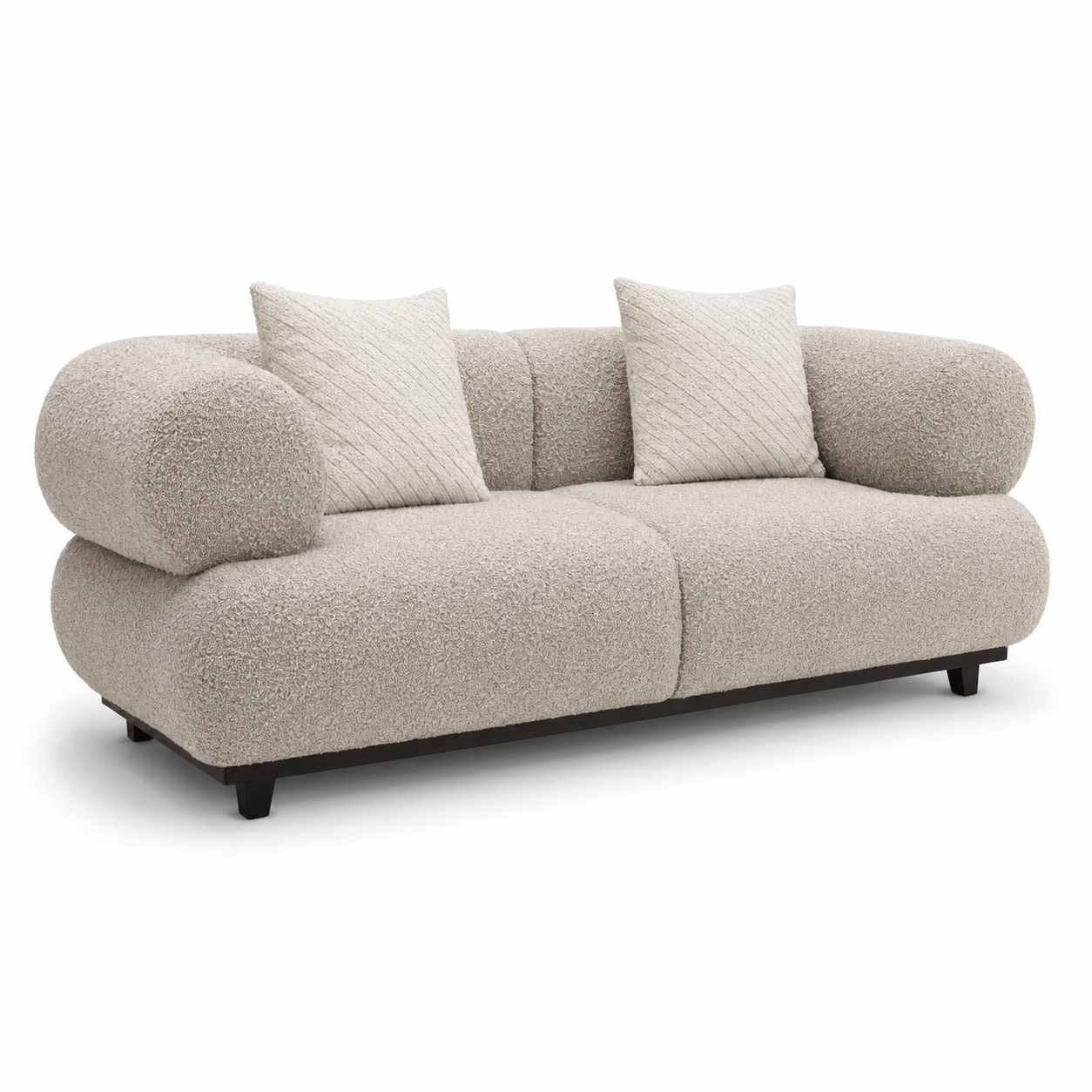 Beige sofa with two cushions on a white background