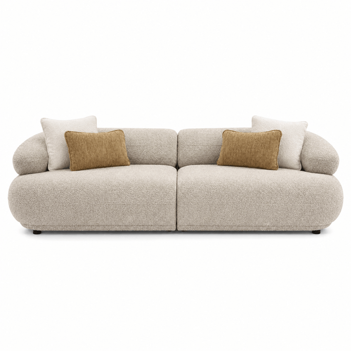 Beige sofa with brown cushions on a white background