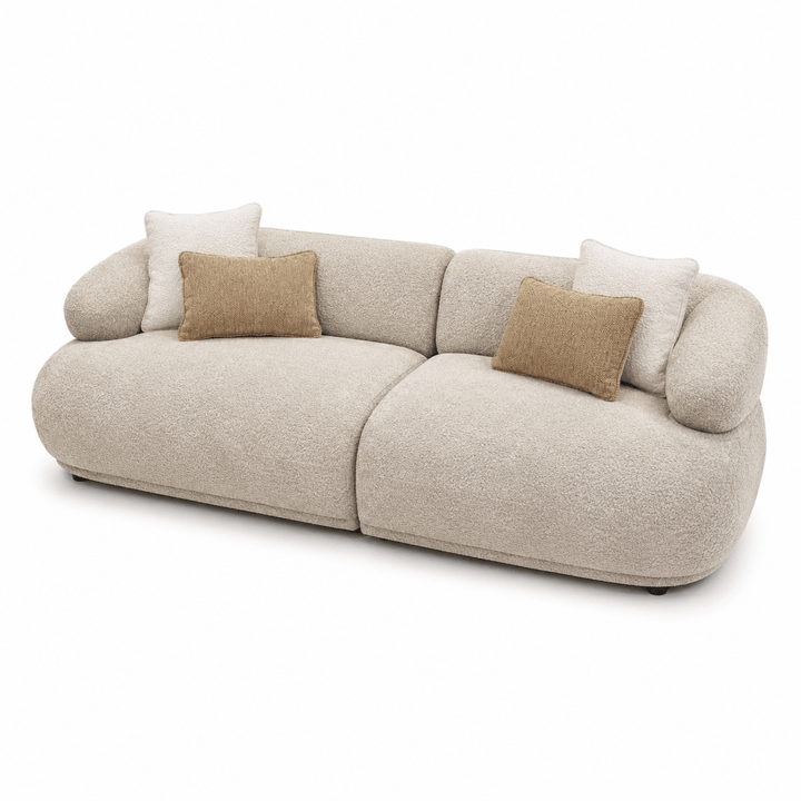Beige sofa with brown cushions on a white background